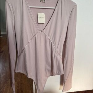 Free People blush Long Sleeve Bodysuit. NWT. Size L